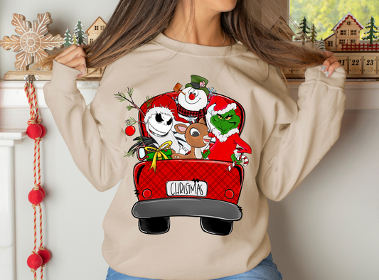 Christmas characters riding in red truck