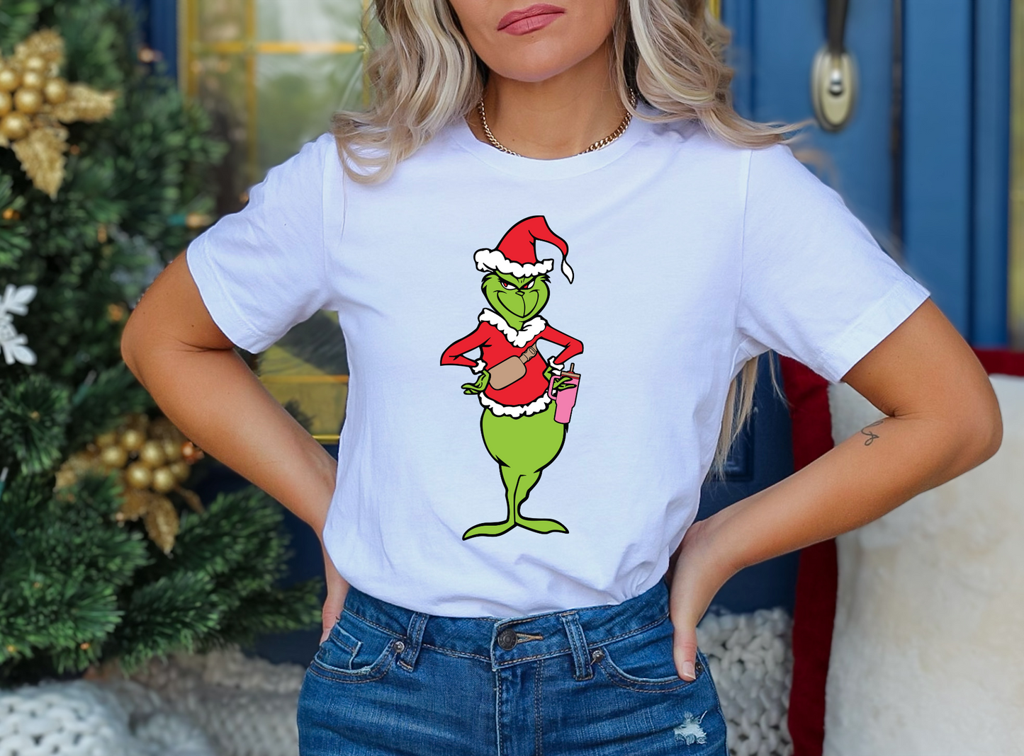 Grinch in Santa suit with iced coffee - hands on hips